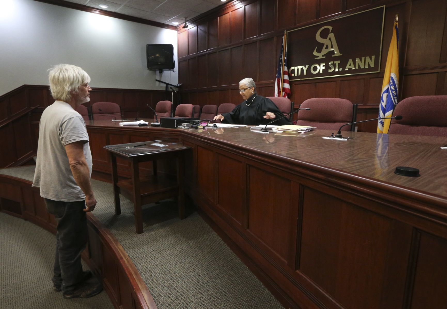 Loyed Longenecker talks to a judge in St. Ann about his Wellston ticket